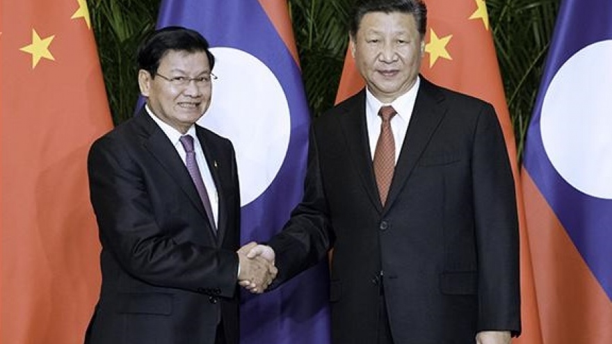 Ông Tập Cận Bình điện đàm chúc mừng Tổng Bí thư Đảng NDCM Lào