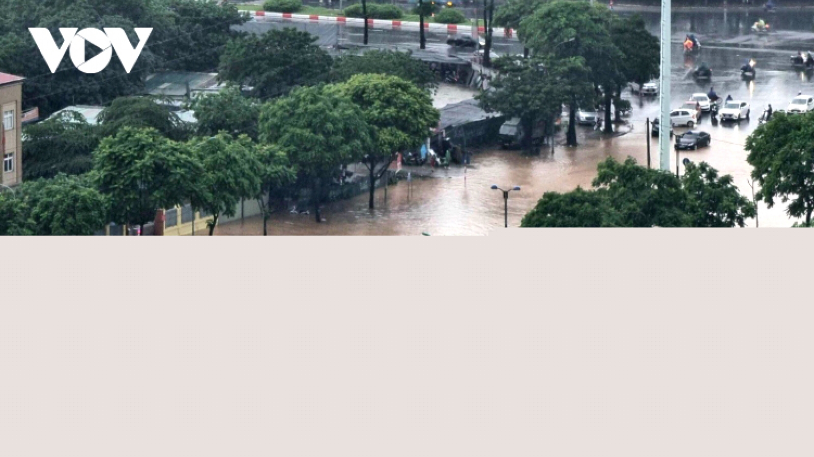Hanoi streets turn into rivers after heavy downpours