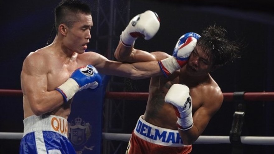 Quan defends title, heads to world level