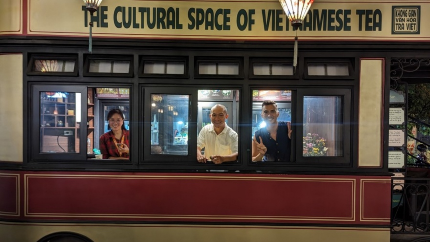 Sipping tea inside old-style streetcar in Vietnamese capital