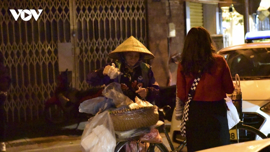 Hanoi's outdoor workers make a living on freezing cold nights