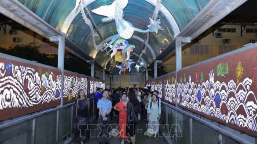 Tran Nhat Duat pedestrian bridge with contemporary art installations opens