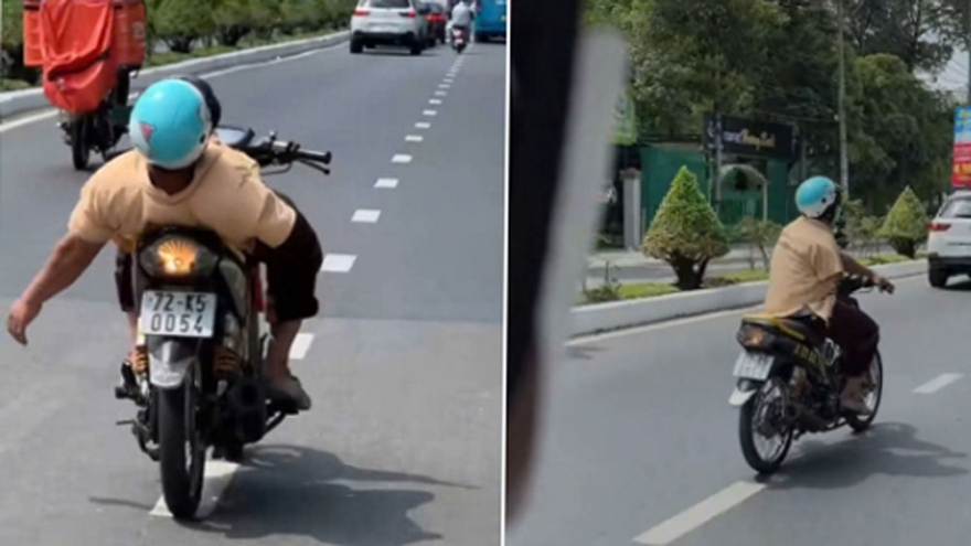 Hết hồn cảnh người khuyết tật vừa lái xe vừa nằm dài ở Bình Dương