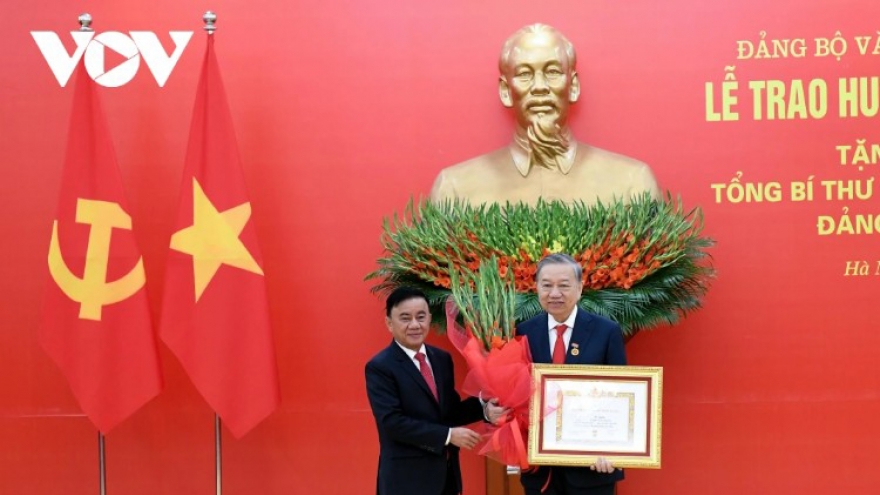 45-year Party membership badge presented to General Secretary To Lam