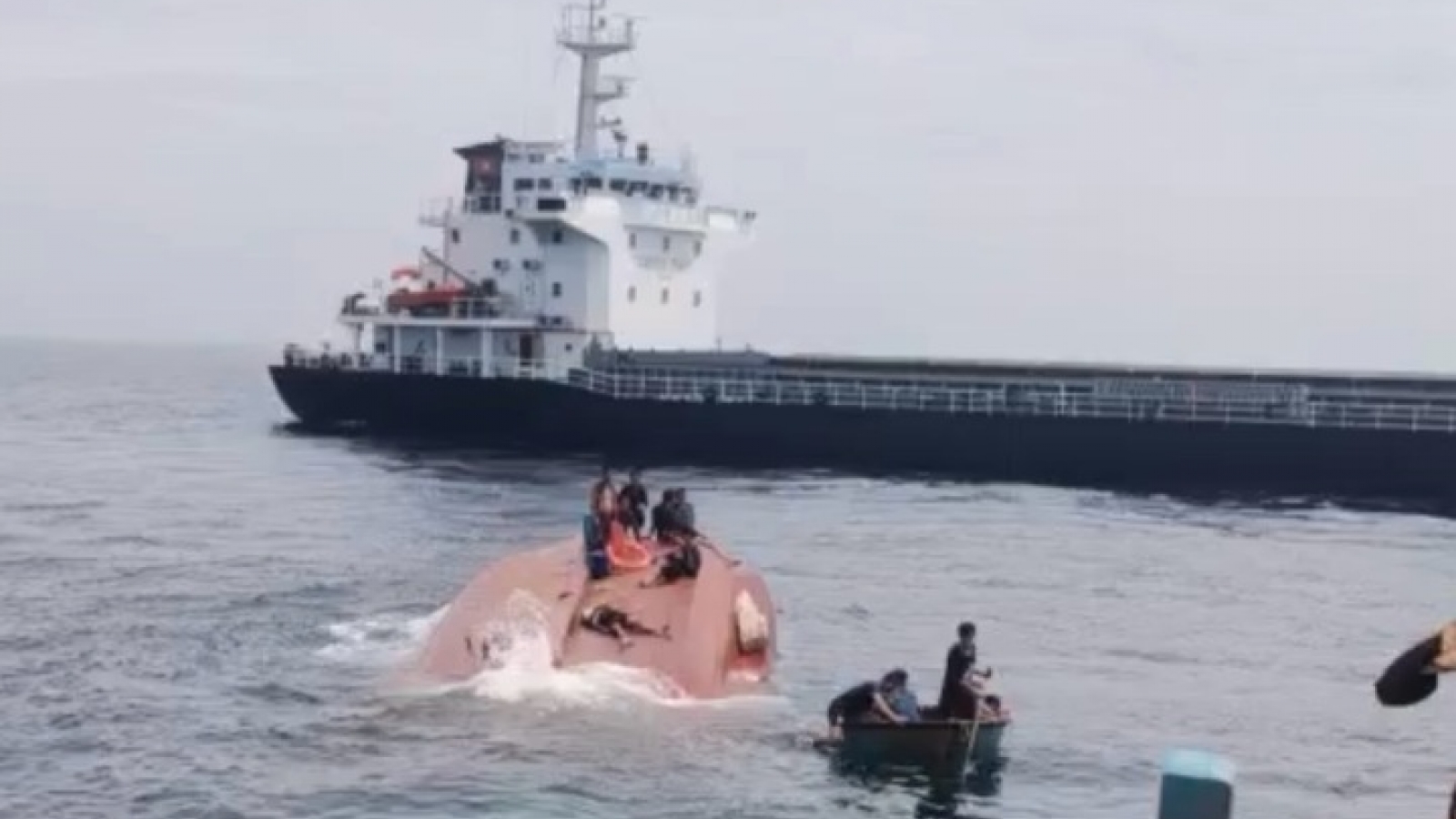 One dead after fishing boat sinks in collision with cargo vessel