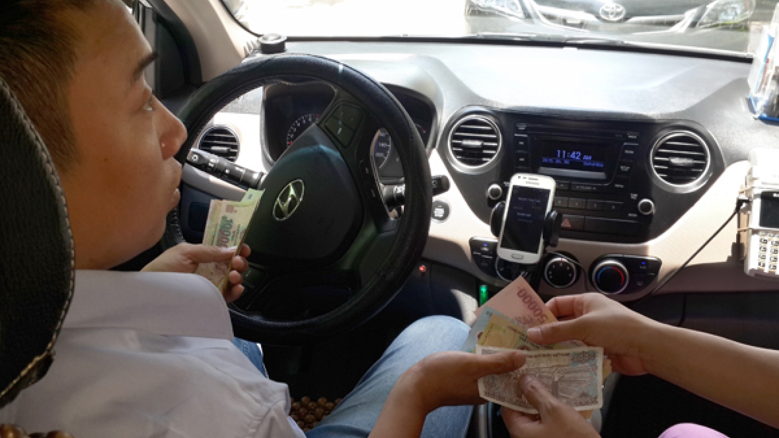 Uber and Grab drivers suddenly up to neck in tax arrears