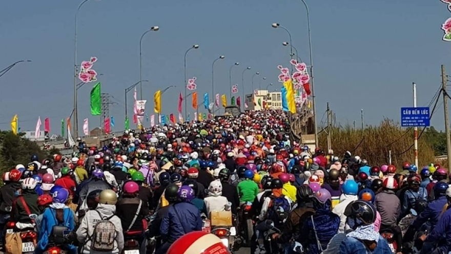 Congestion hits HCM City as people return after Tet