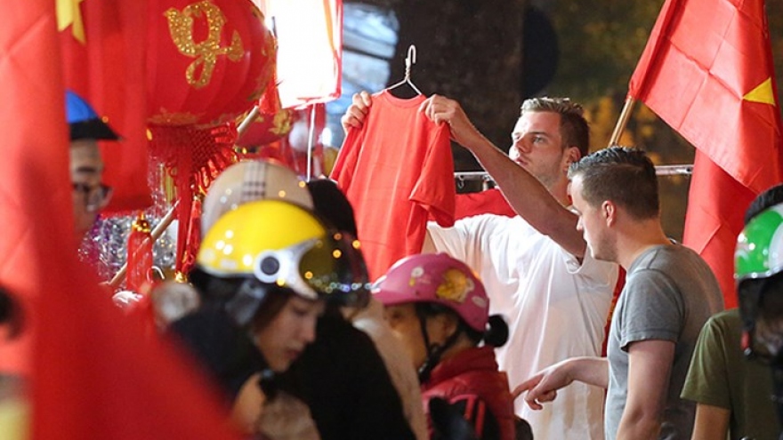 Hang Ma Street a flurry of trade in banners and red flags