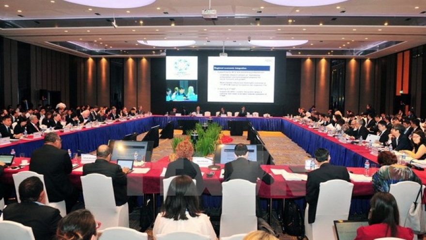 APEC SOM3 deals with pile of work