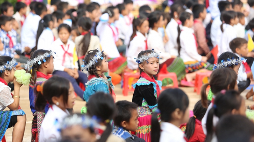 Crossing river on raft for school year opening ceremony