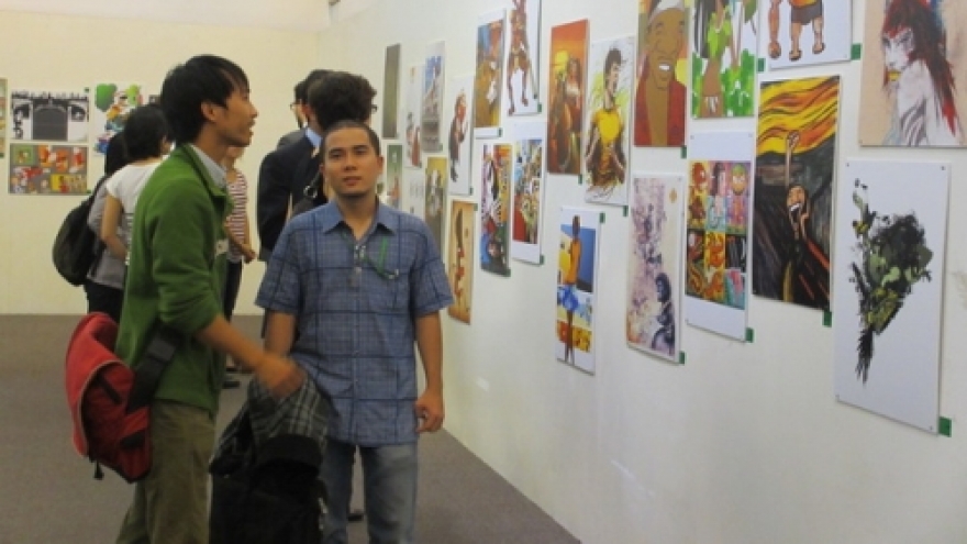 Illustrative paintings on display in Hanoi   