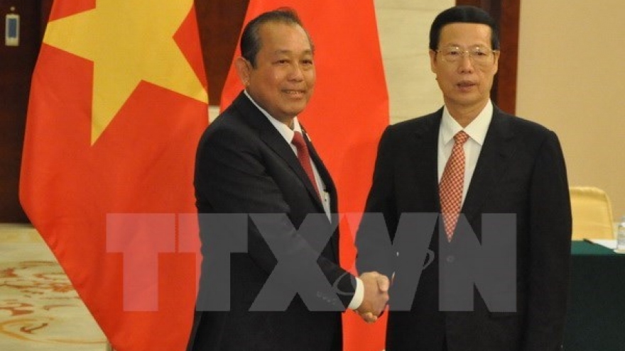 Vietnam, China urged to boost economy, trade, investment
