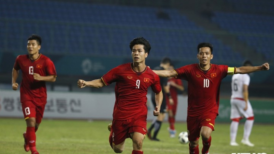 Vietnam's national squad celebrate victory over Bahrain 