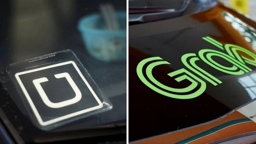Ministry opens investigation into Grab’s acquisition of Uber in Vietnam