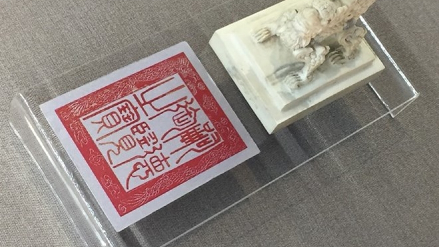 Hue exhibits royal items carved with dragons, phoenixes