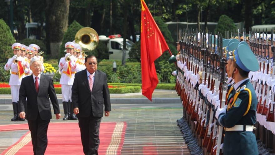 In photos: Lao President welcomed in Hanoi