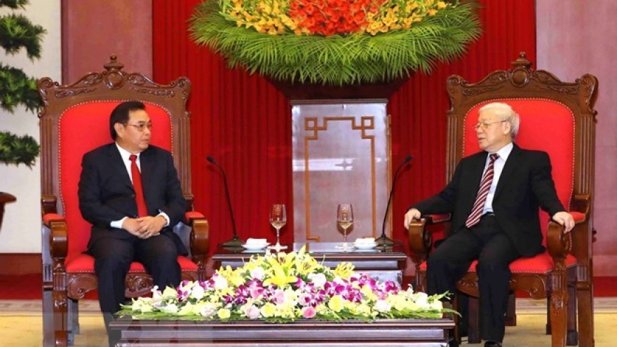 Laos vows to work with Vietnam to enhance bilateral ties