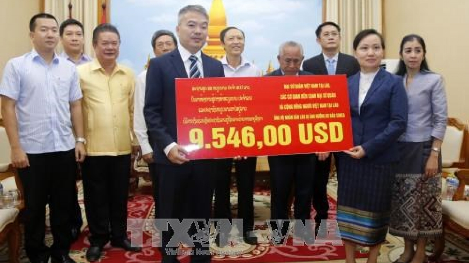 OVs make donation to typhoon victims in Laos