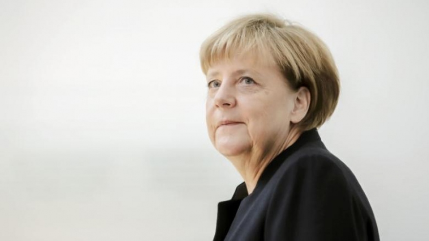 Germany's Merkel says she has not changed course on migrant policy
