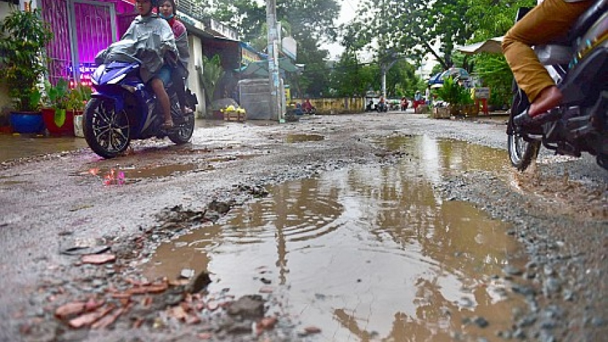 Damaged roads become hazards in HCM City