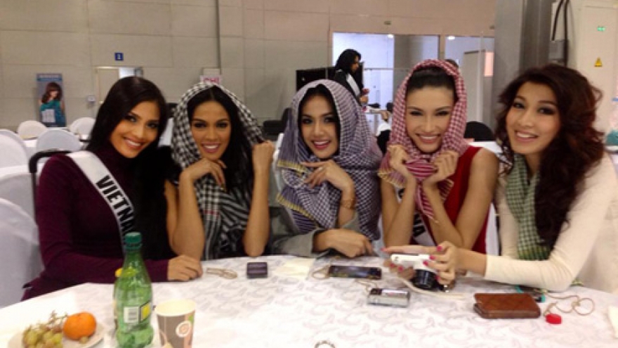 Miss Universe contestants model traditional scarves