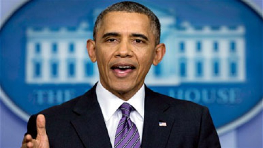 Obama signs trade bills into law