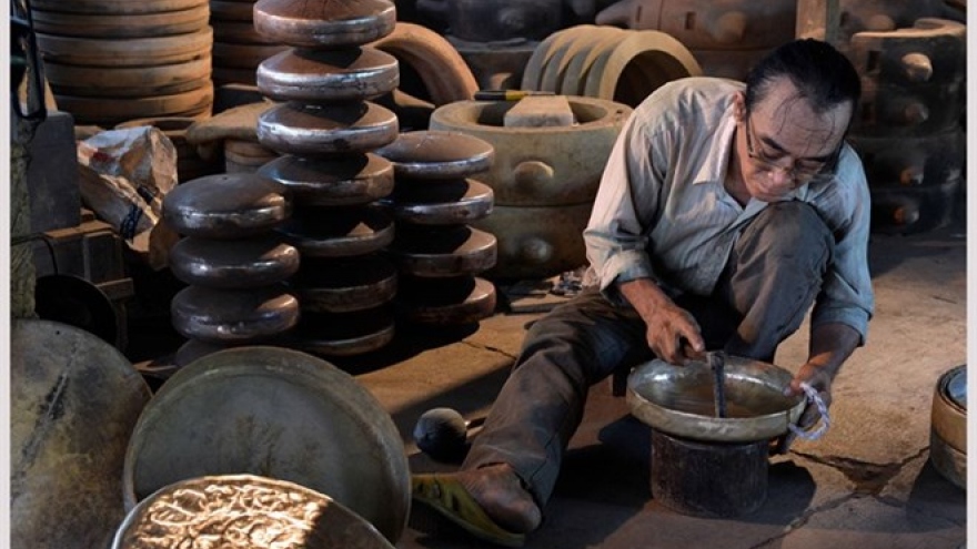 Phuoc Kieu villagers keep forge fires burning