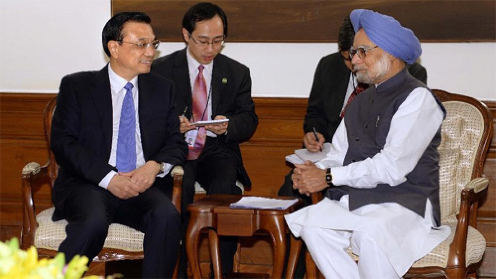 Behind the handshake of two Asian giants