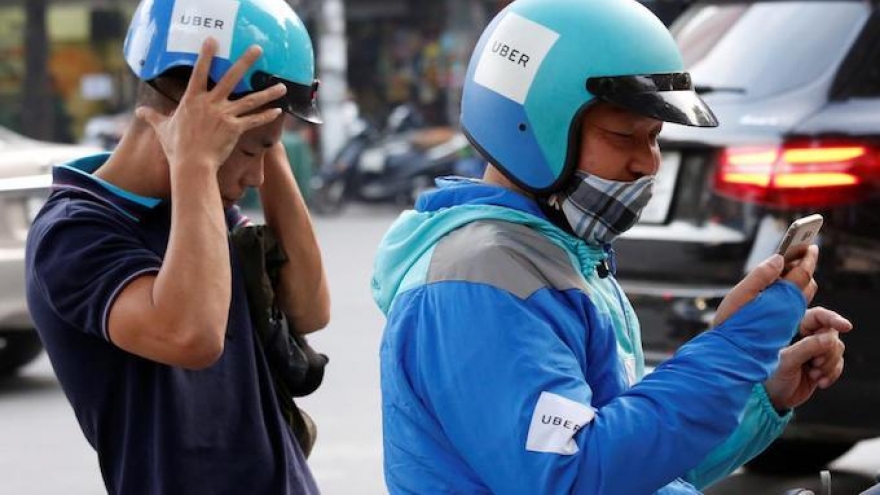 Grab makes takeover bid for Uber’s SEA operations, including Vietnam: reports