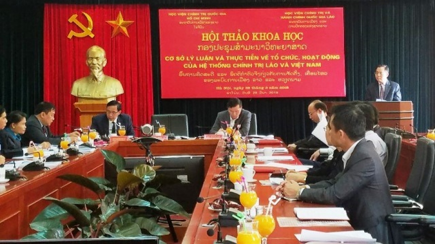 Vietnam, Laos exchange experience in political system operation