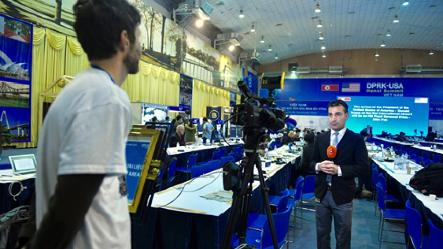 Busy night at international media centre as Kim-Trump Summit draws near