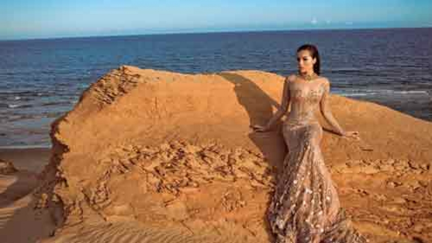 Ky Duyen strikes a pose amongst sand dunes at Mui Ne