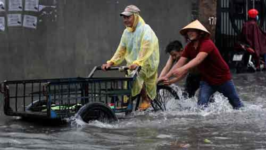 Torrential rain inundates HCM City streets