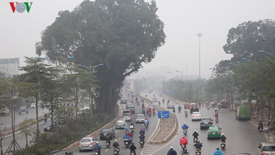 Dense fog fills Hanoi streets