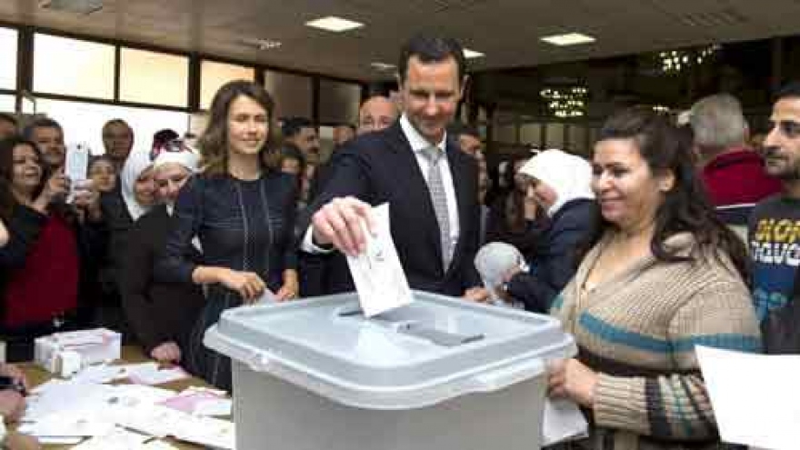 Assad holds parliamentary election as Syrian peace talks resume