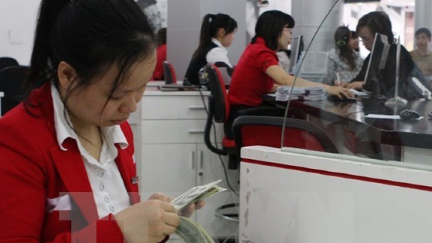 Central bank widens VND/USD trading band