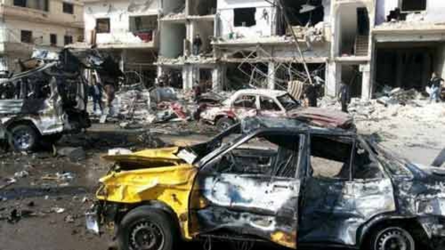 Twin bombings claimed by Islamic State kill dozens in Syria's Homs