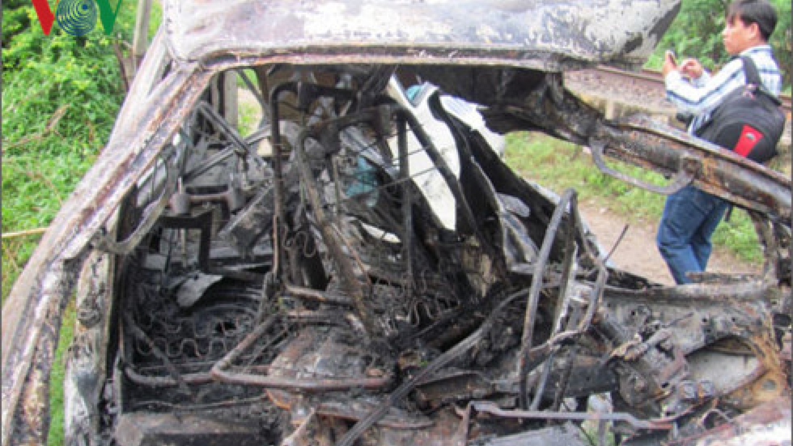 Commuter train slams into passenger bus, catches fire in Vietnam