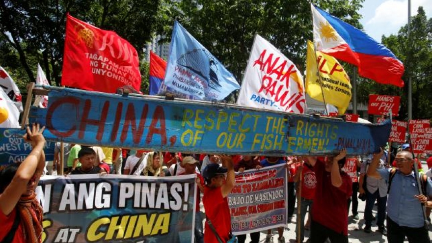 China vows to protect South China Sea sovereignty, Manila upbeat