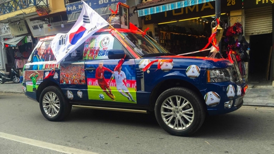 Fans decorate their vehicles in support of Vietnamese team