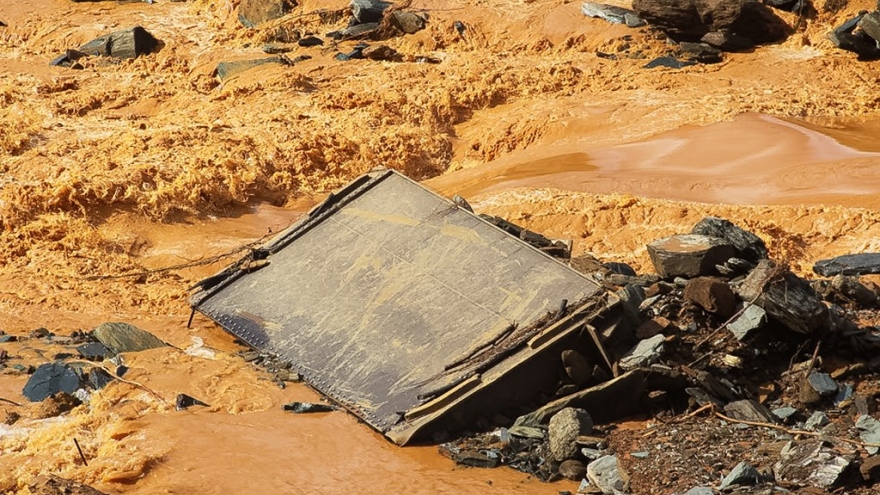 Dam break disaster photos: toxic mud buries area