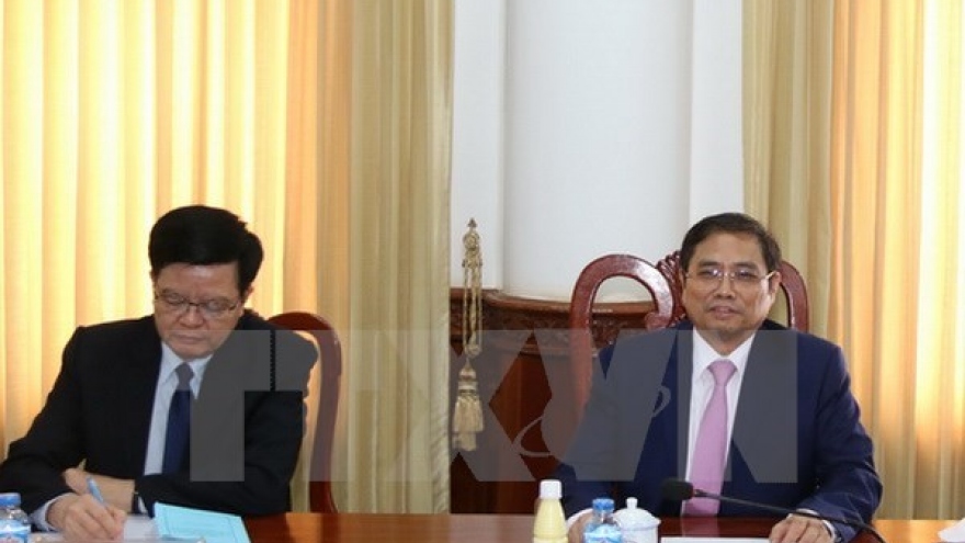 Vietnam, Laos Party organisation commissions enhance cooperation