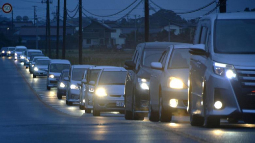 Tsunami hits Japan after strong quake, nuclear plant briefly disrupted