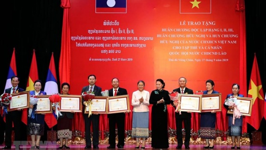 Friendship orders presented to Lao NA collectives, individuals