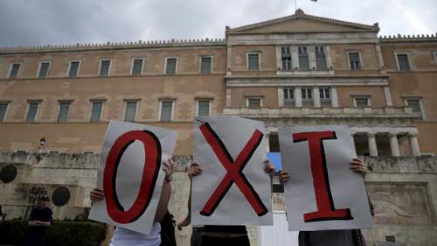 Greece imposes capital controls as crisis deepens