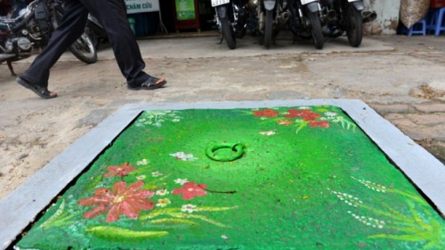 Painted manhole covers in Saigon hoped to increase environmental awareness