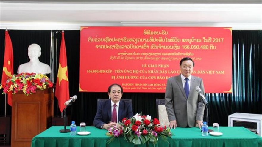 Lao people raise funds for Vietnamese storm victims