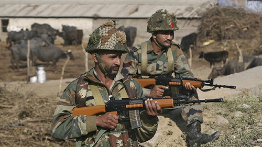 Gunfire, blasts at Indian air base, two militants still at large