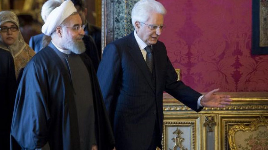 Deals and warms words flow as Iranian president visits Europe