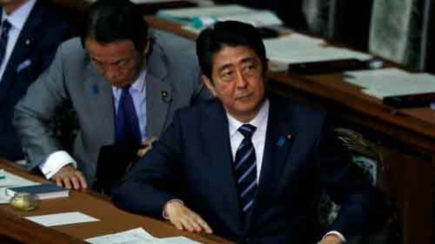 Japan PM to postpone sales tax rise, snap election off table for now